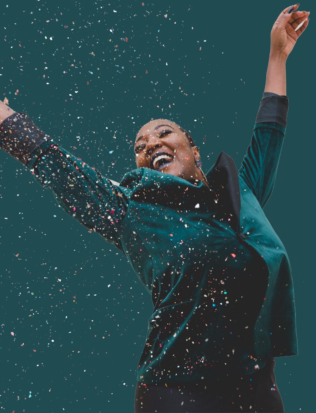 happy woman jumping in confetti